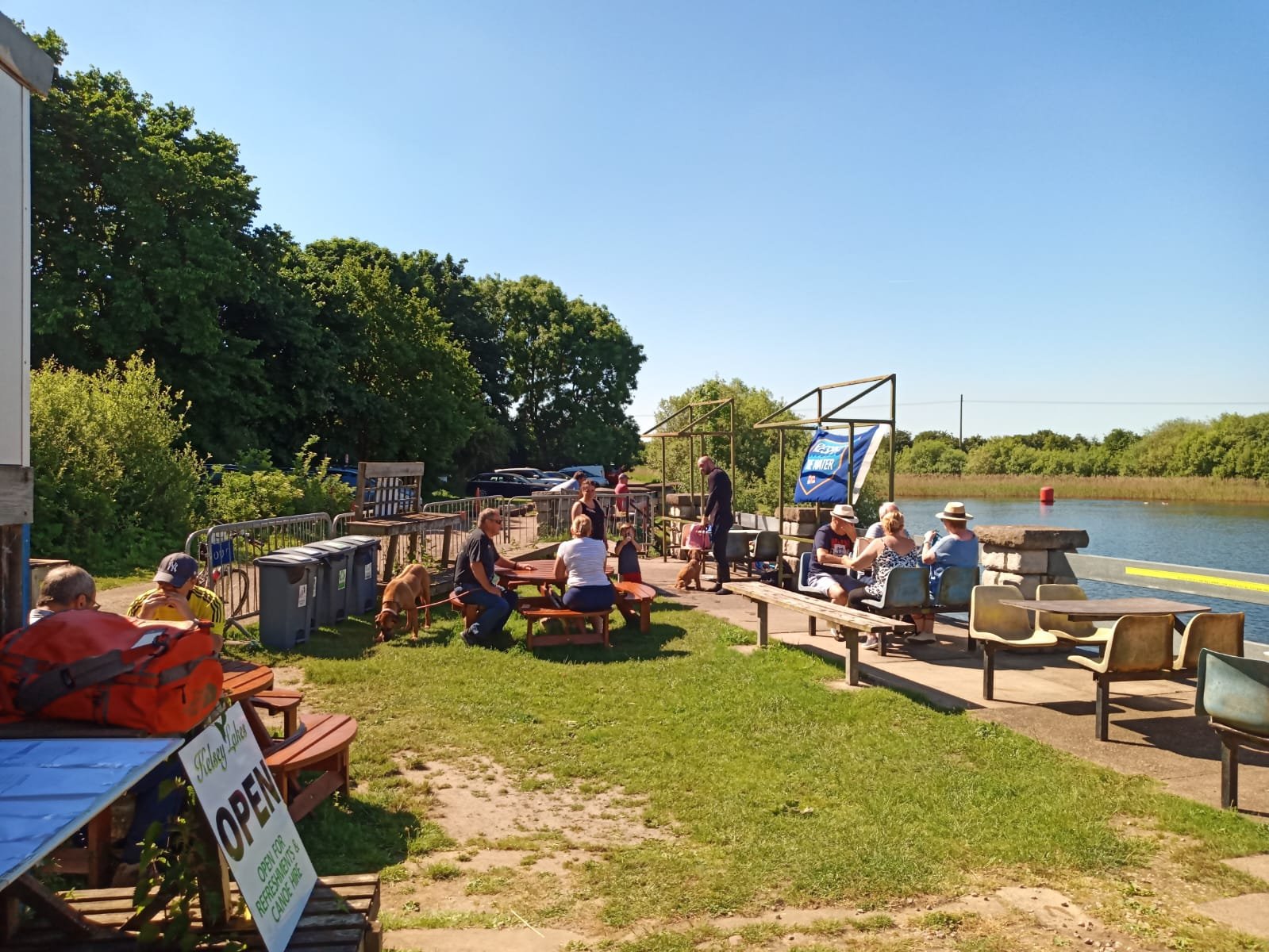 Lakeside seating and picnic area at Kelsey Gardens
