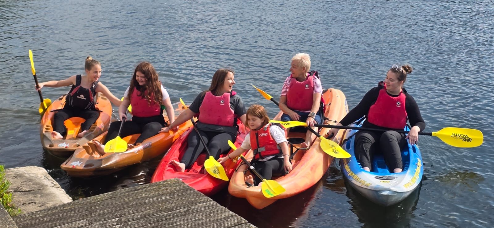 Kayak group launching onto the lake